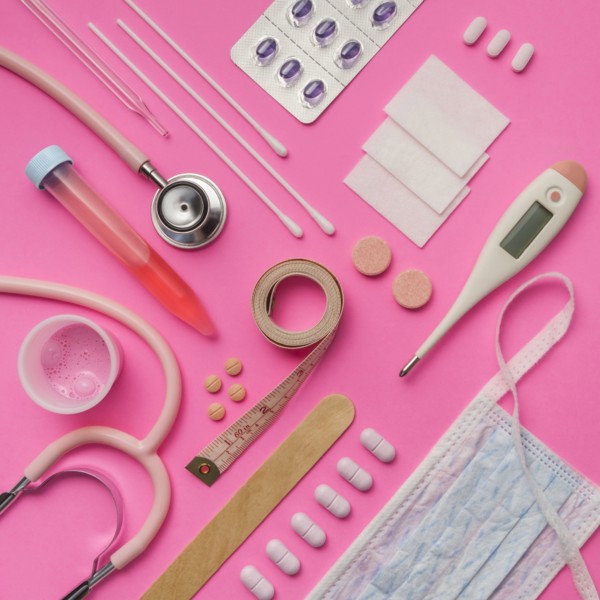 Medical supplies on pink background