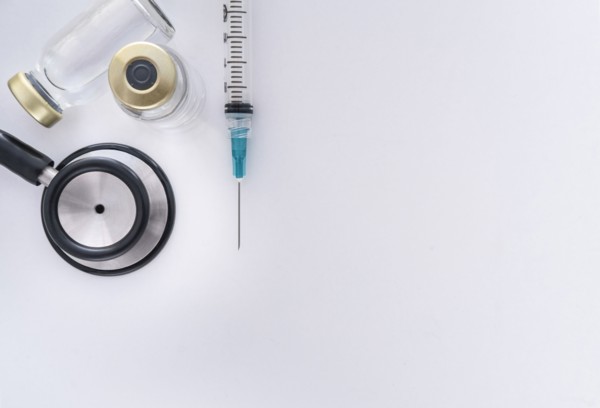 Studio shot of stethoscope, vials and syringe