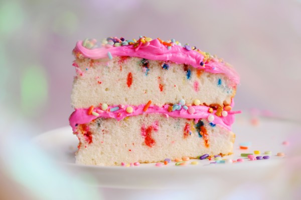 Slice of festive cake on cake stand