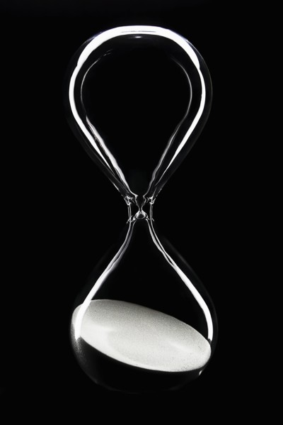 Hour glass on black background