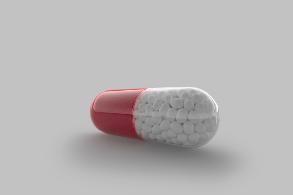 Studio shot of red and white capsule
