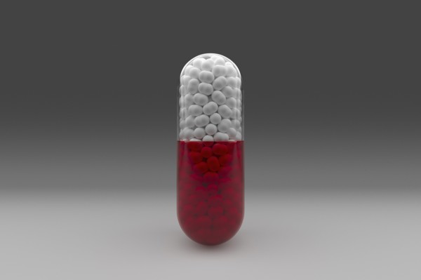 Studio shot of red and white capsule