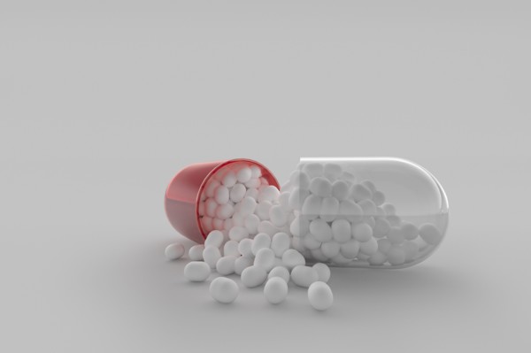 Studio shot of red and white capsule