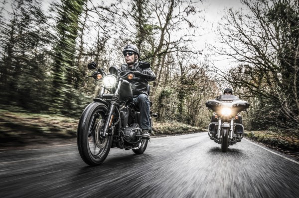 United Kingdom, London, Motorcyclists on road in forest
