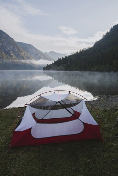 Austria, Plansee, Tent by lake Plansee at sunrise