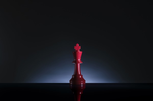 Studio shot of red chess king