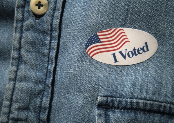 Close-up of I voted sticker on denim shirt