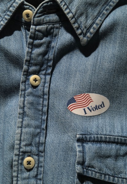 Close-up of I voted sticker on denim shirt