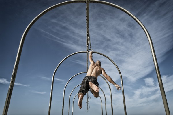 Man exercising on gymnastics rings