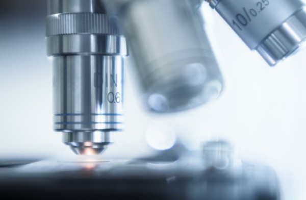 Close-up of laboratory microscope lens