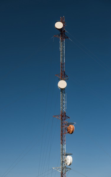 Communication tower against blue sky