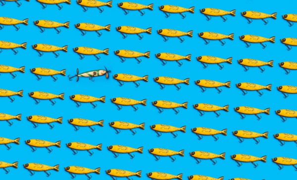 Vintage fishing lures on blue background
