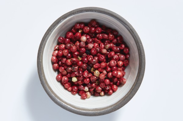 Red peppercorns in bowl
