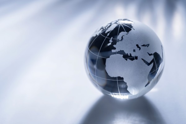 Glass globe on gray background
