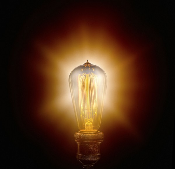 Edison light bulb on black background