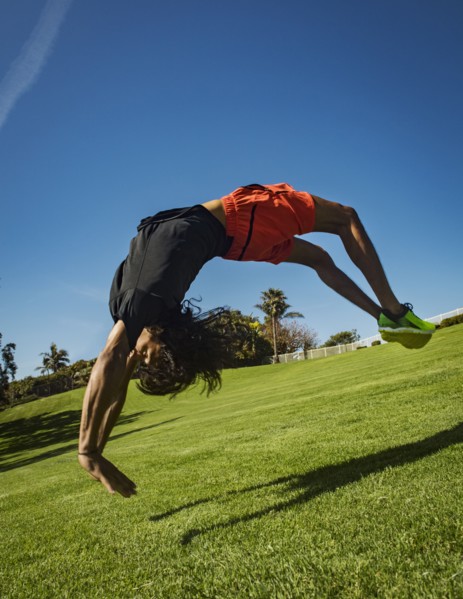 Man flipping over grass