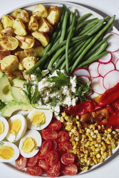 Colorful vegetables, salad and eggs on plate