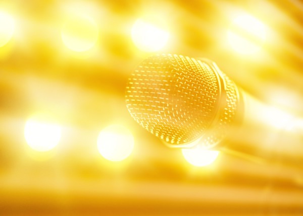 Close-up of microphone and stage lights