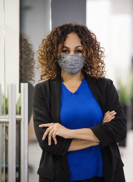 Portrait of businesswoman wearing face mask in office