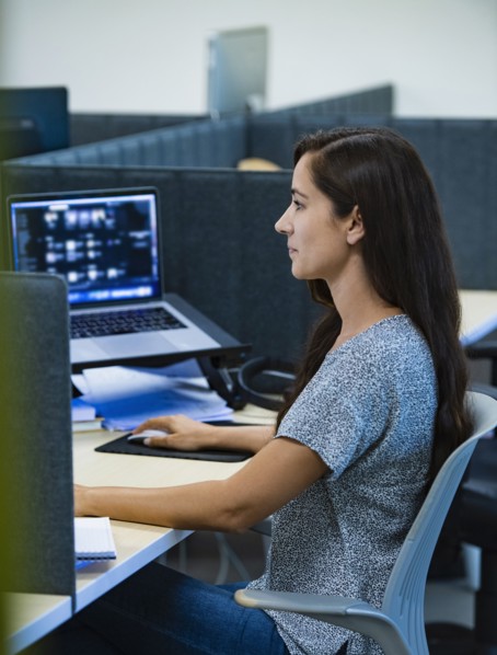 Woman working on computer in office