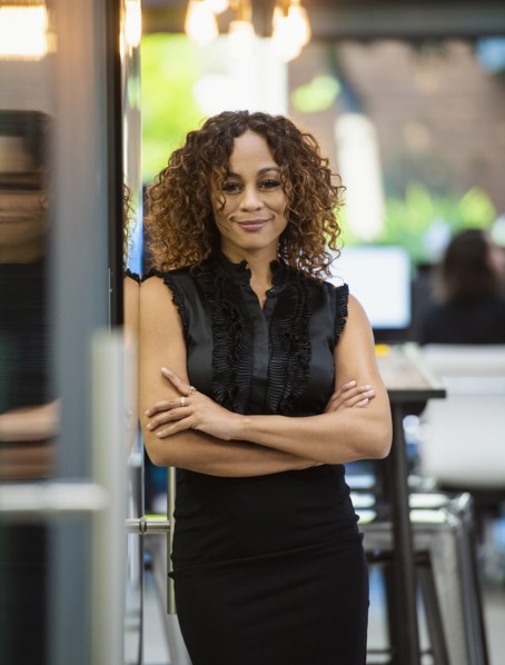 Portrait of smiling woman standing in office