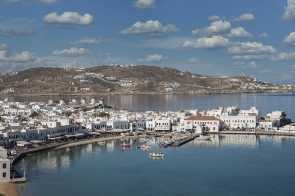 Fishing boats in harbor and white houses