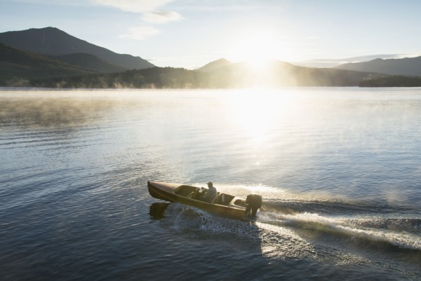 Man in motorboat on Lake Placid