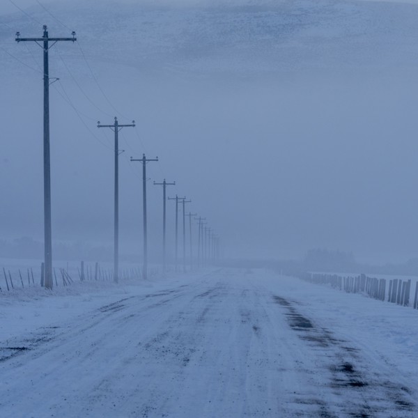 Empty frozen rural road in winter