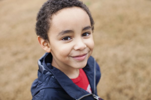 Mixed race boy smiling