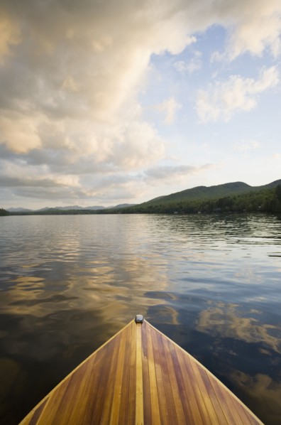 Wooden boat on Lake Placid at sunset