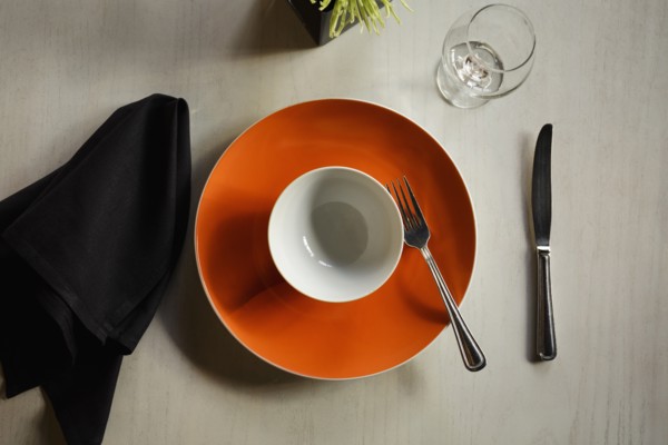 Empty plate among table setting