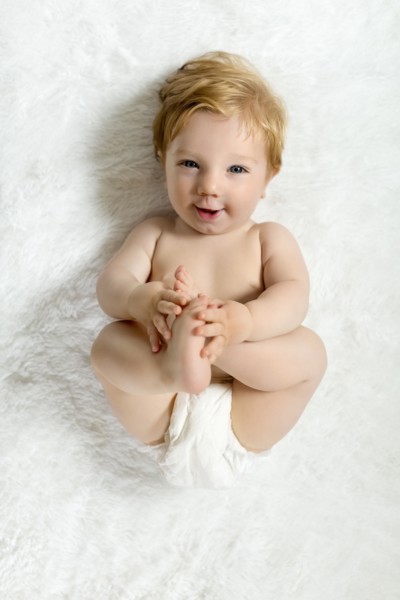 Toddler lying on blanket
