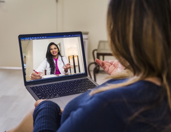 Woman having video call with doctor