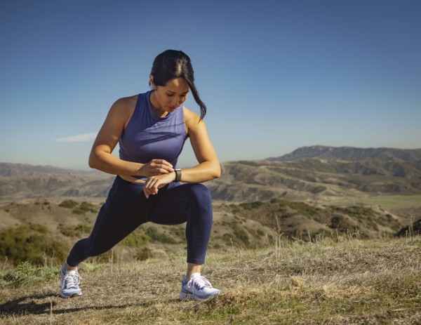 Woman stretching in landscape