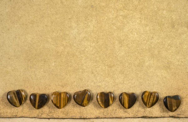 Wooden hearts on beige background