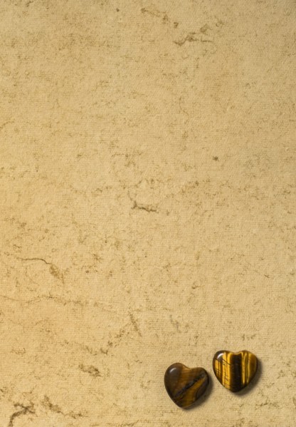 Wooden hearts on beige background