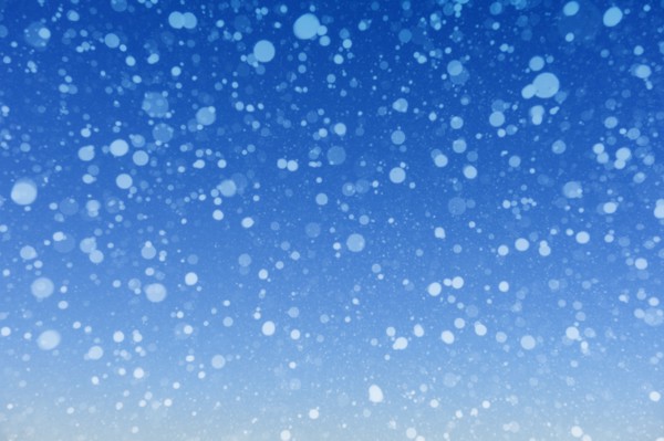 Falling snow against blue background