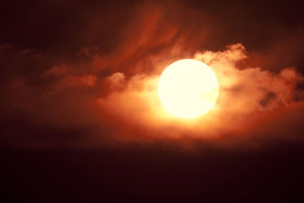 Setting sun among clouds