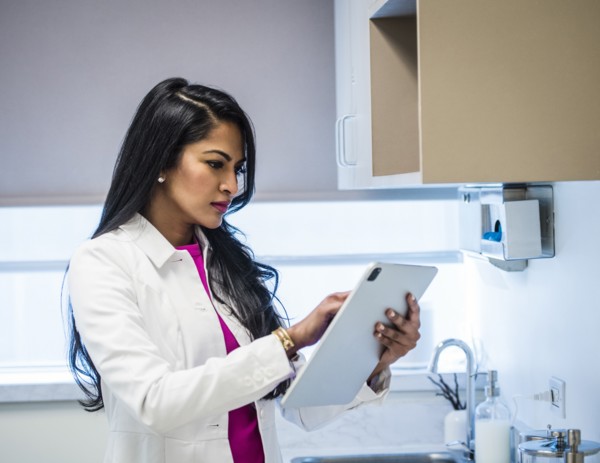 Female doctor with medical documents