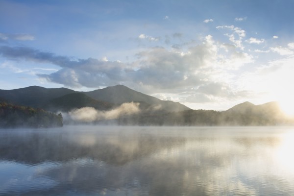 Usa, New York, Whiteface Mountain reflecting in Placid Lake