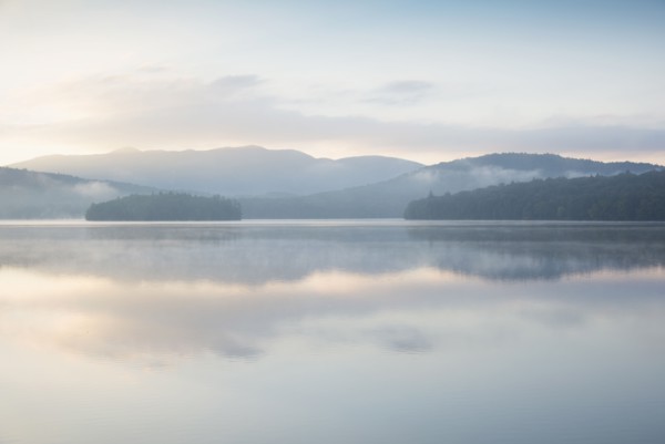 Usa, New York State, North Elba, Morning fog over Placid Lake