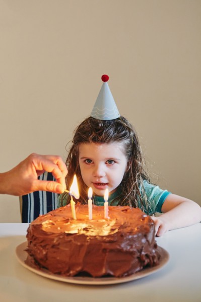 Girl celebrating her third birthday
