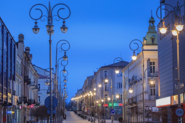 Poland, Holy Cross, Kielce, City street illuminated at night