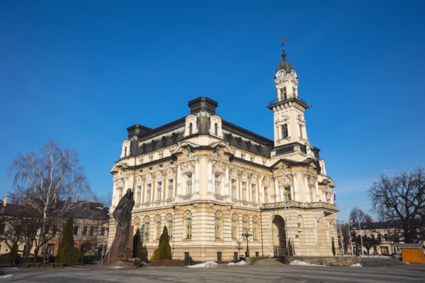 Poland, Lesser Poland, Nowy Sacz, Town hall at town square with sculptured monument