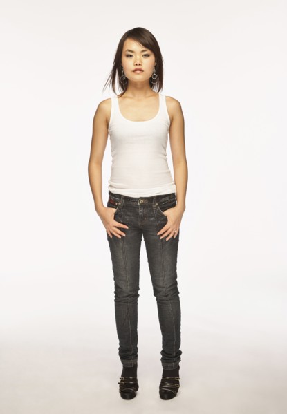 Studio portrait of woman in white tank top