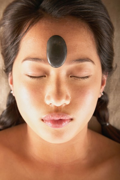 Woman with rock on forehead