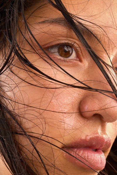 Close-up of woman with wet brown hair
