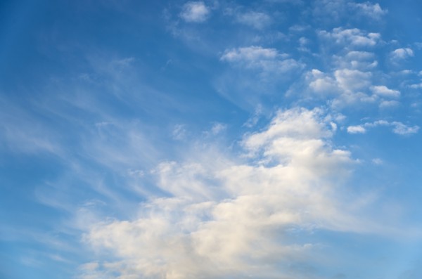 Blue sky with soft puffy clouds