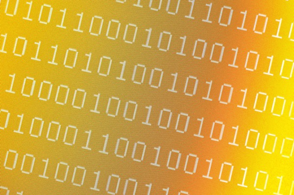 Binary numbers on pixelated yellow computer screen