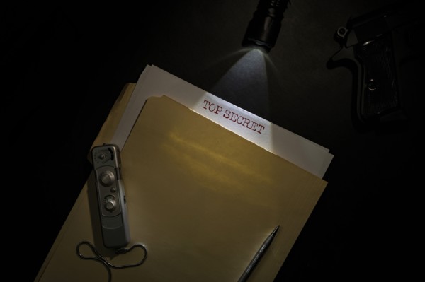 Overhead view of top secret documents on desk top